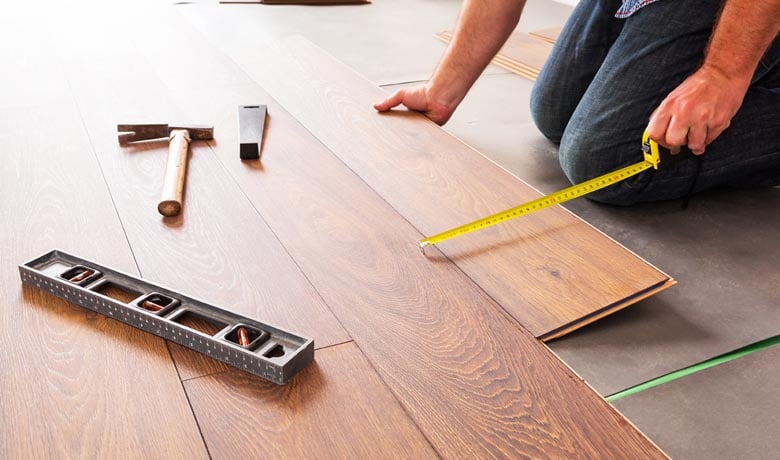 Man staggering laminate flooring