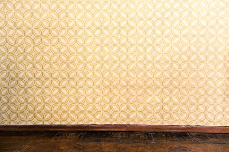 old wallpapered wall in a house