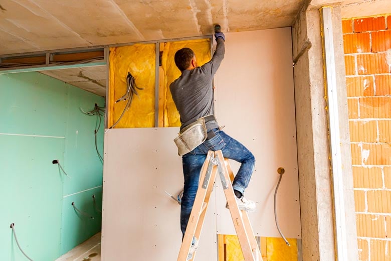 plasterboard being installed in a room
